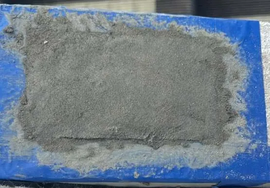 Concrete patch repair with repair mortar on top of a roof slab edge